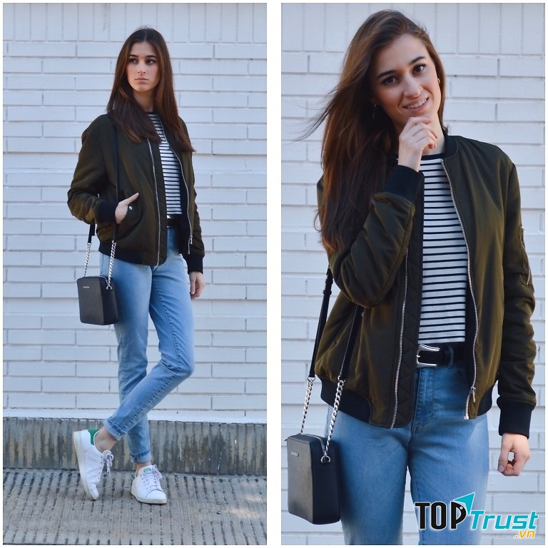 Bomber jacket kết hợp cùng áo kẻ sọc và quần jean xắn gấu bên trong, gam màu lạnh cá tính nhưng không kém phần thời thượng nhờ vào chiếc áo khoác bomber jacket bên ngoài, đừng quên mang theo bên mình một chiếc túi xách với set đồ này