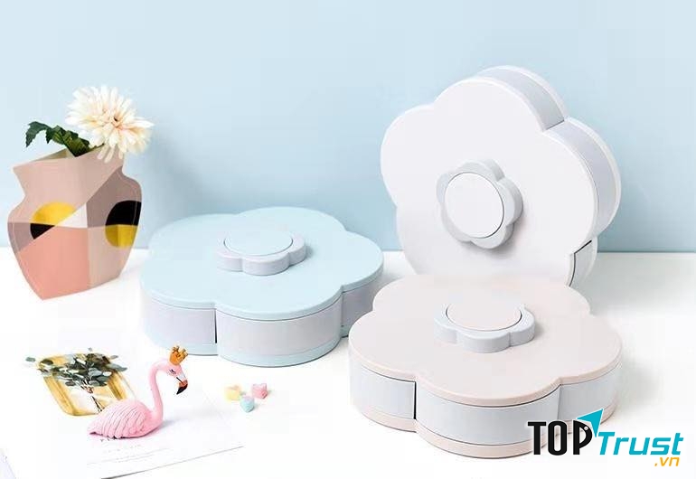 Hộp bánh mứt xoay tròn nở hoa 5 cánh.