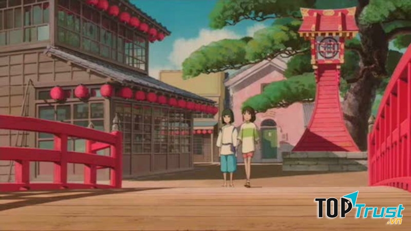 Haku nắm tay Chihiro qua cầu.